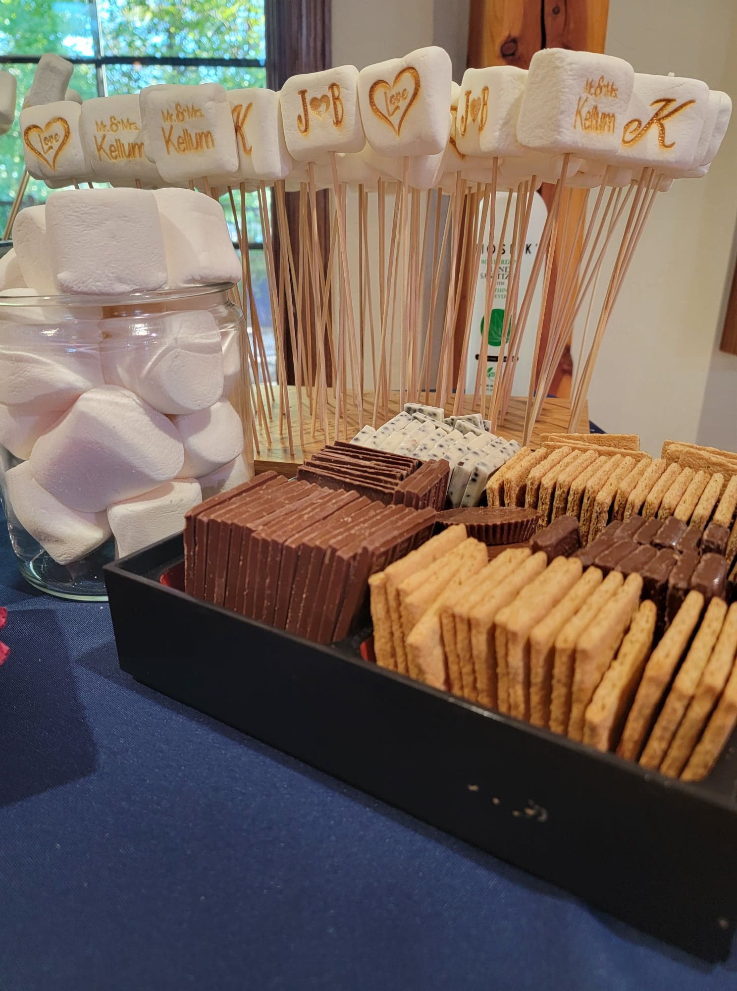 Smores bar with different graham crackers and marshmallows and chocolate