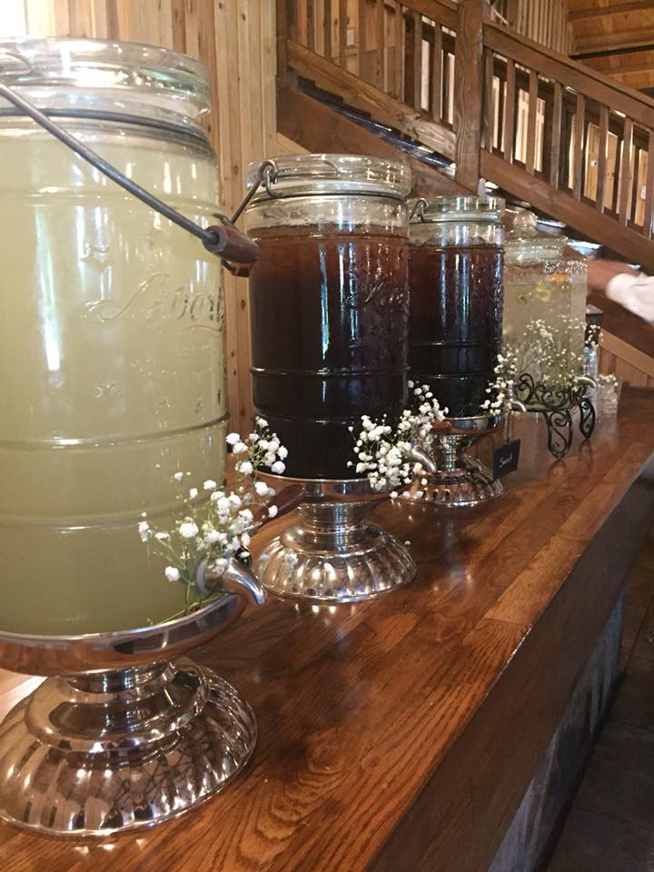 sideboard set up of glass beverage servers 